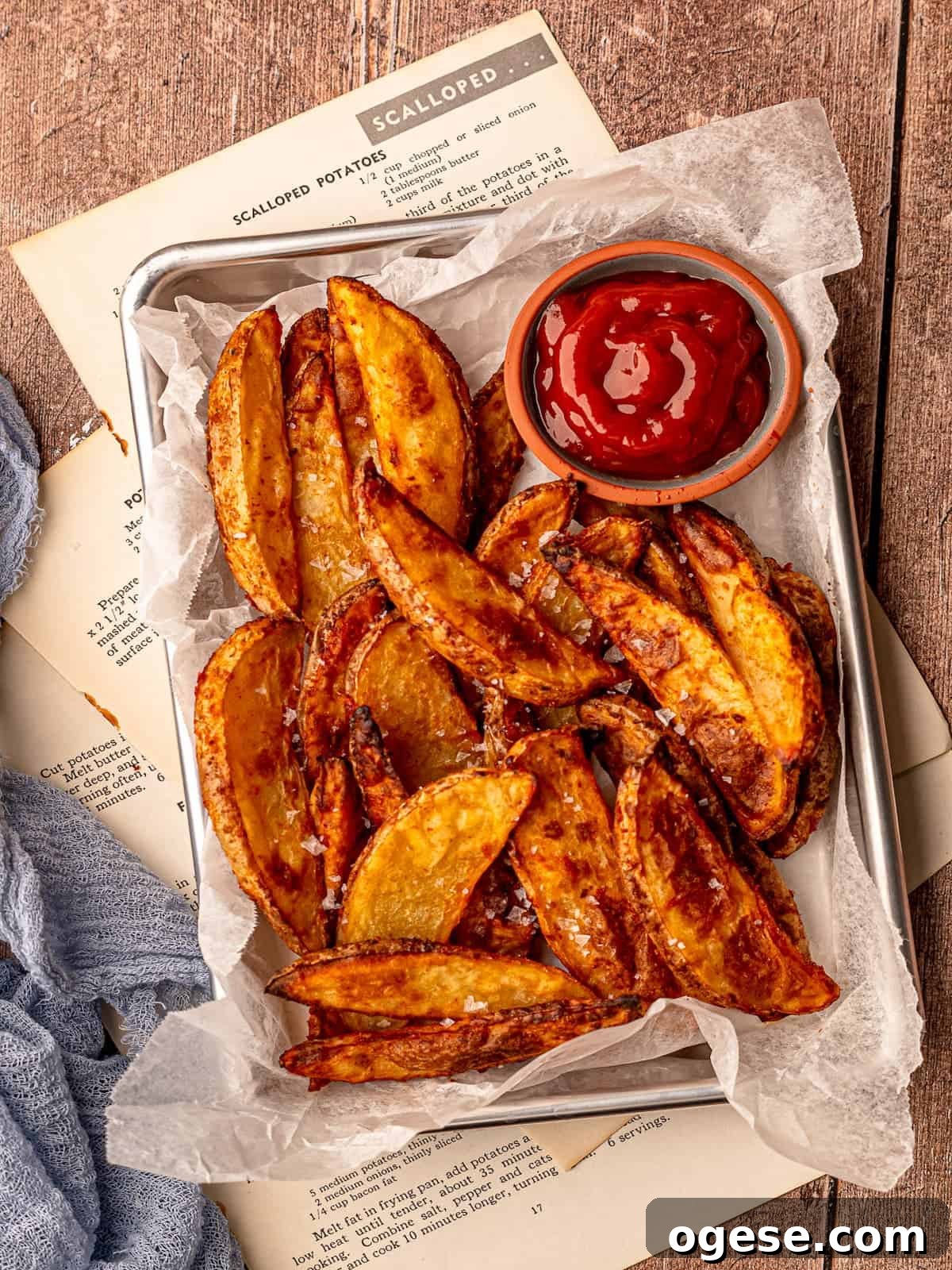 A tray of air fryer steak fries and a bowl of ketchup.