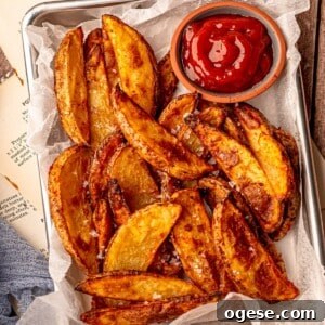 Potato wedges with ketchup.