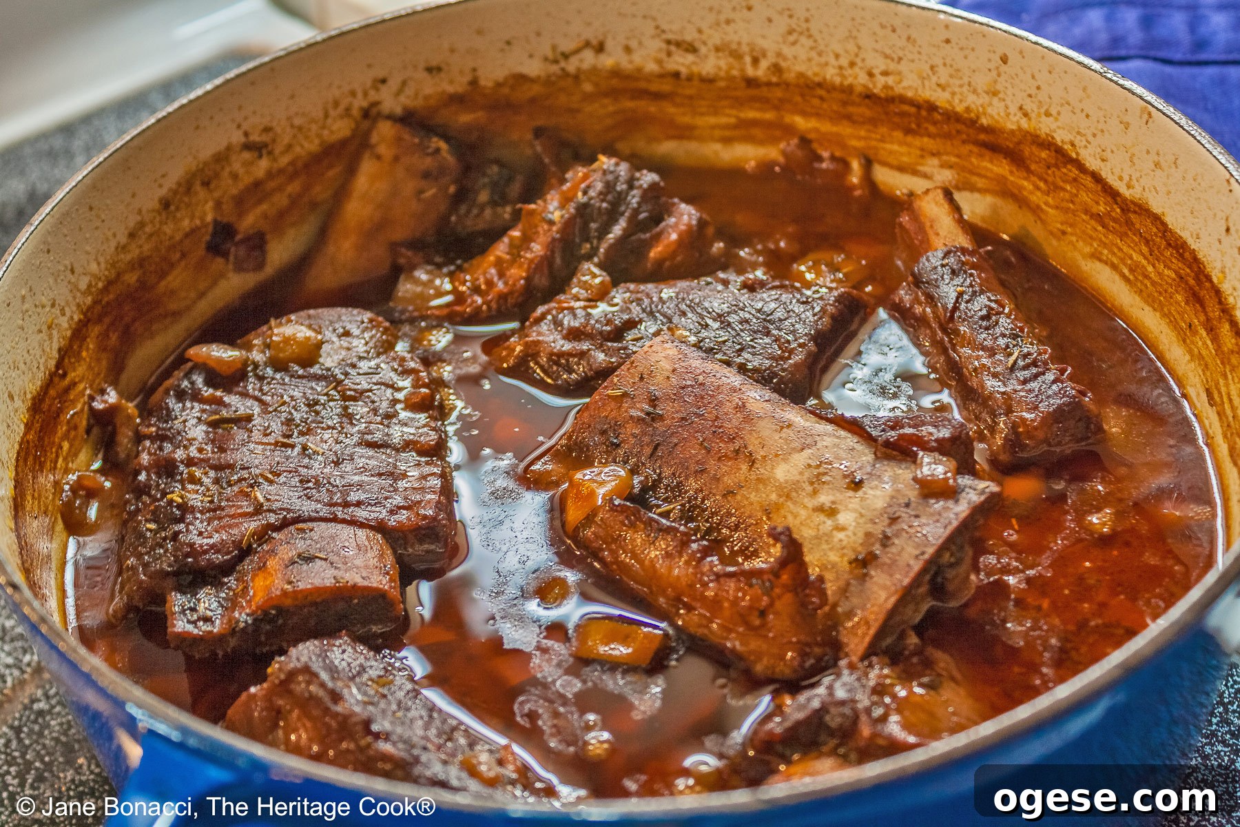 Red Wine-Braised Short Ribs (Gluten-Free) 4 Dutch oven filled with short ribs and braising liquid ready for serving.