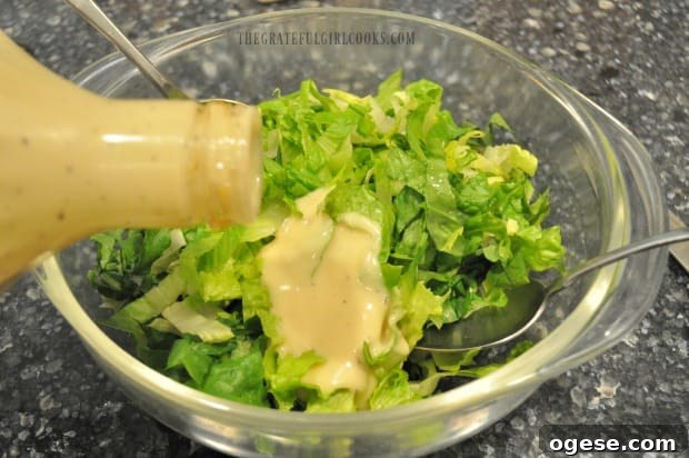 Easy Chicken Caesar Salad - The Grateful Girl Cooks! Romaine lettuce is topped with Caesar dressing.