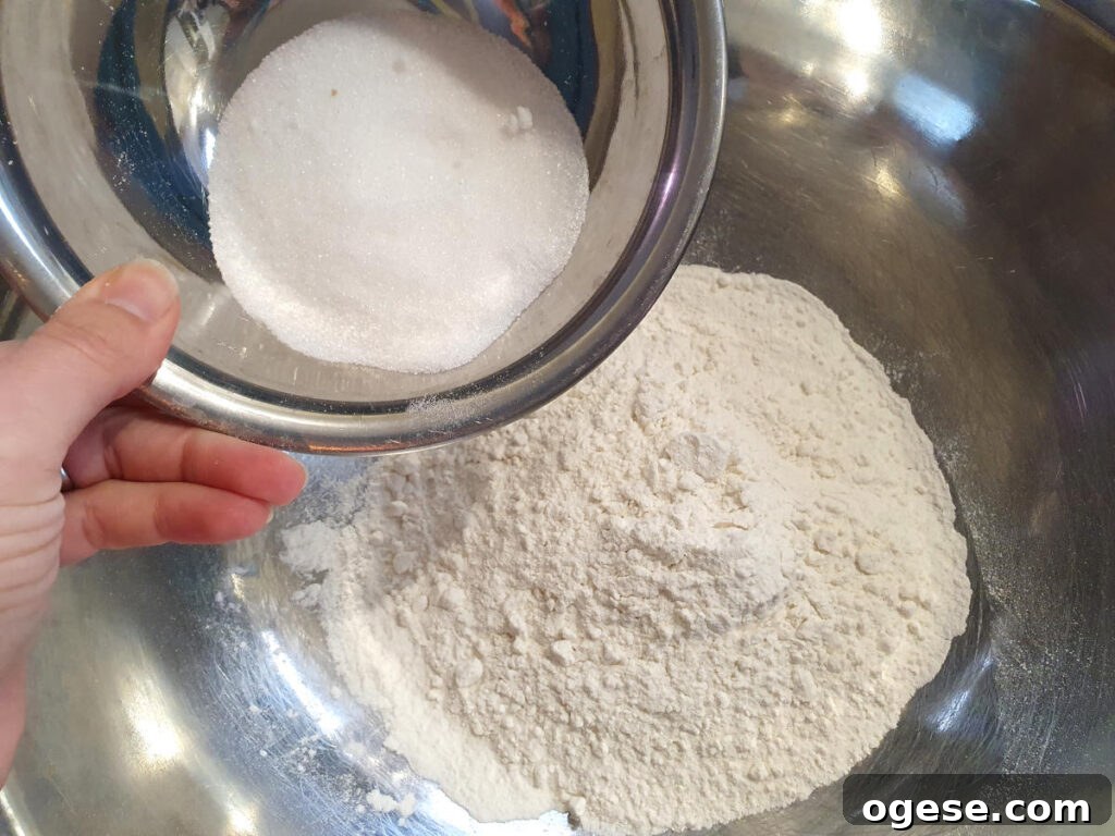 Adding sugar to flour for cobbler topping