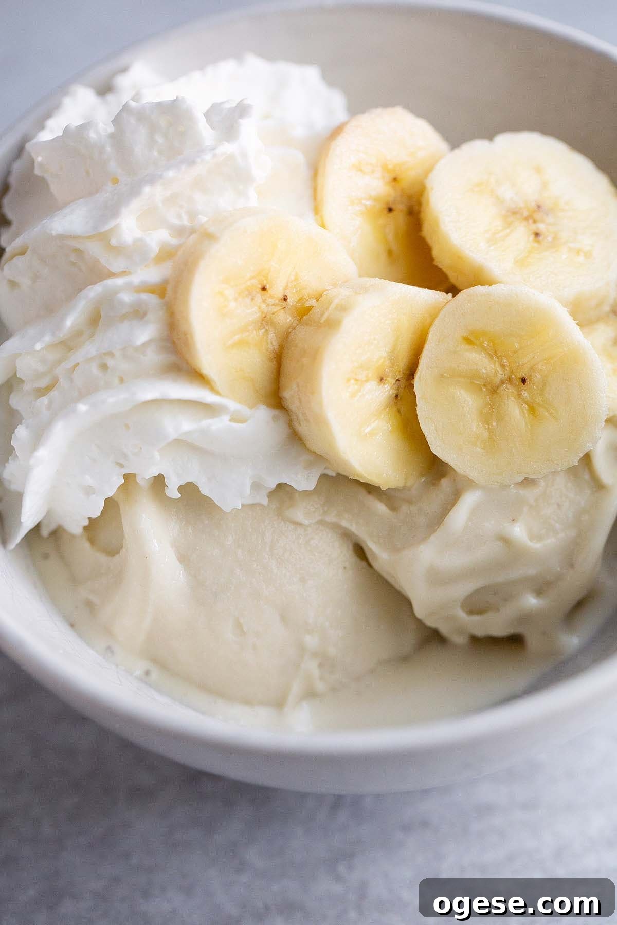 Make Banana Cream Pie Ice Cream in Your Ninja Creami 8 Ninja Creami banana cream pie ice cream topped with sliced bananas and whipped cream