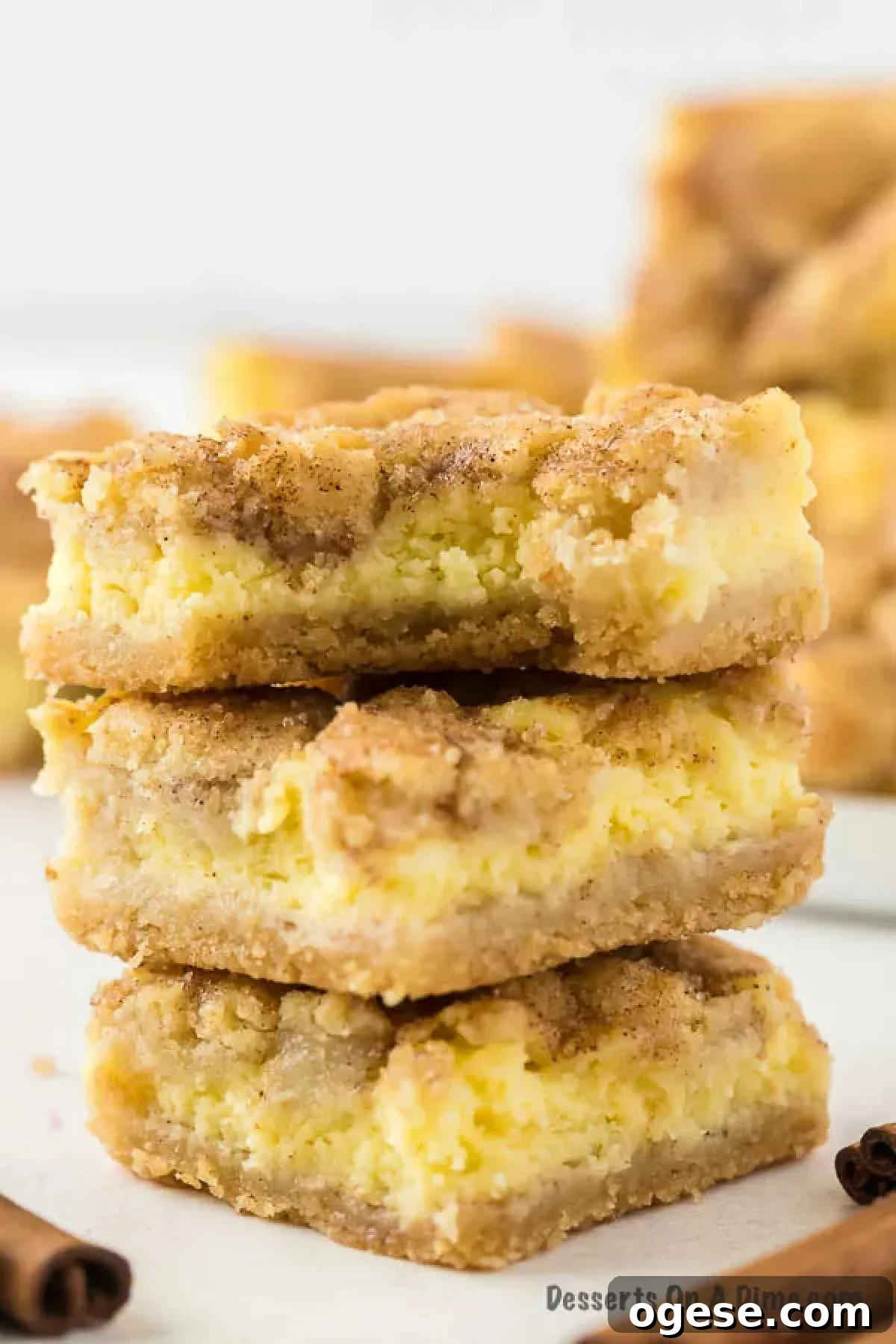 Snickerdoodle cheesecake bars cut into squares. 
