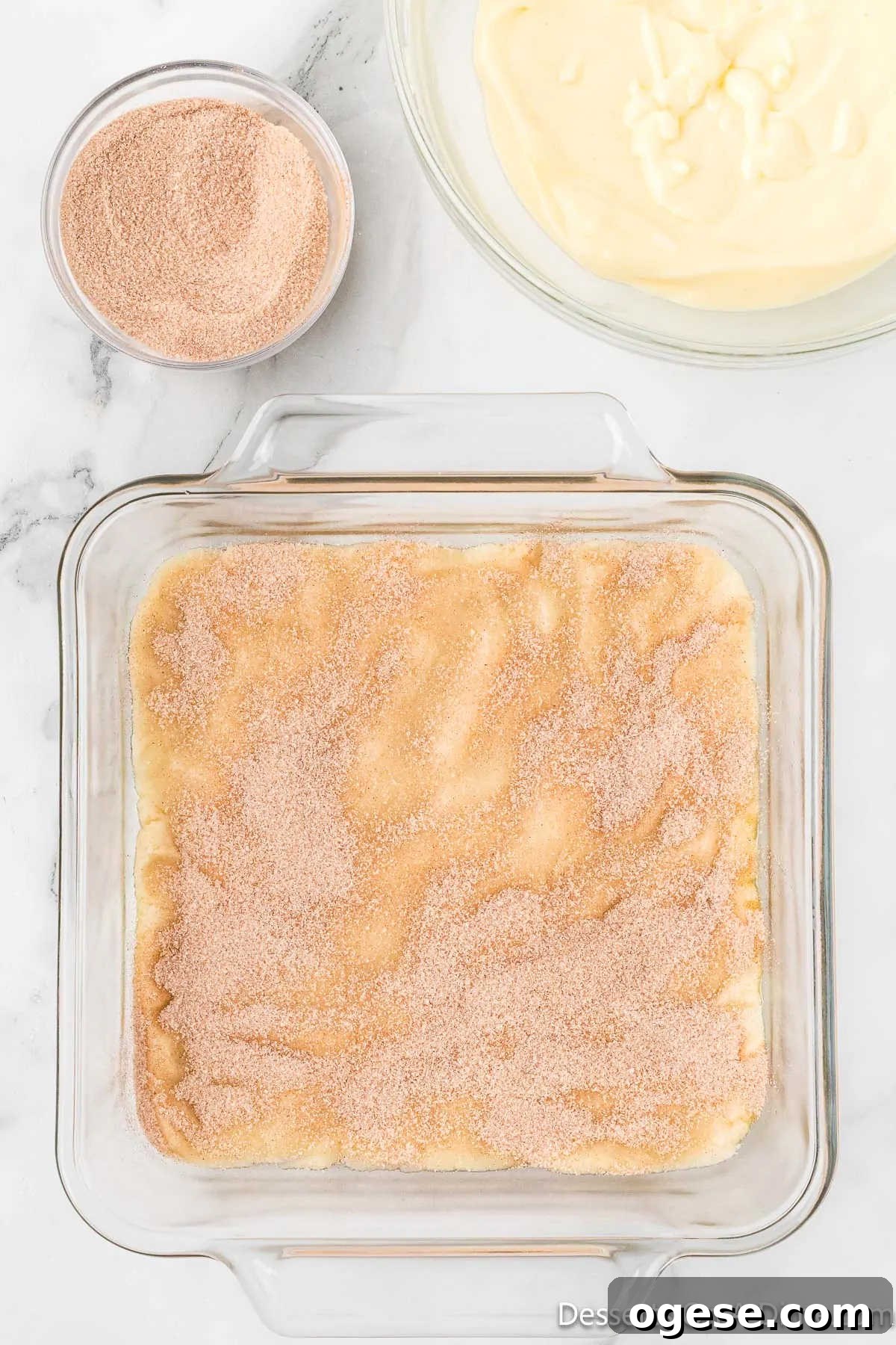 Cinnamon sugar sprinkled on top of dough. 