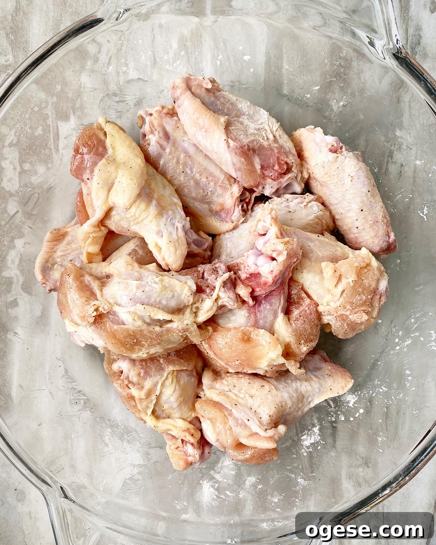 raw chicken wings seasoned with salt, pepper, and starch