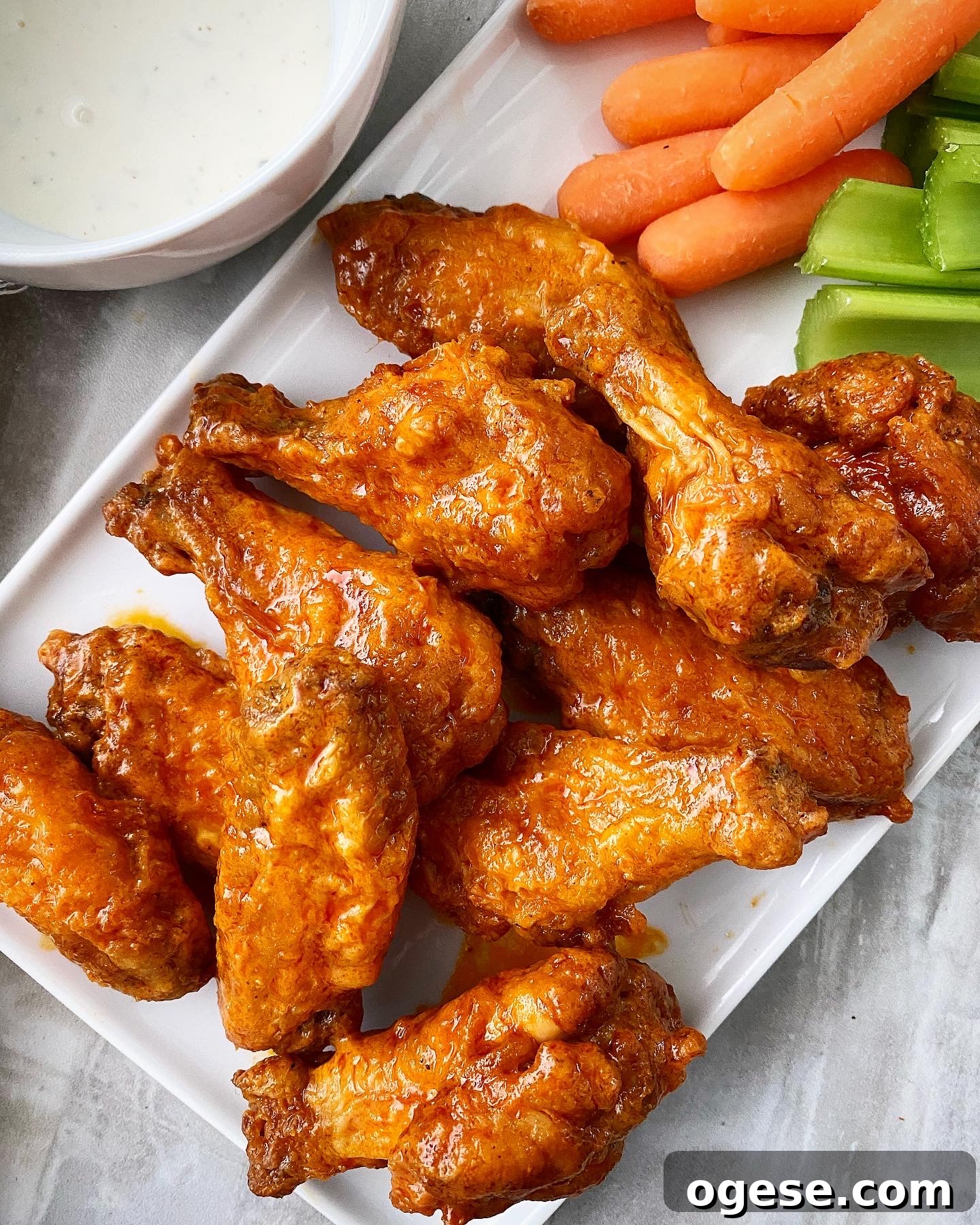 air fryer buffalo chicken wings with celery, carrots, and ranch