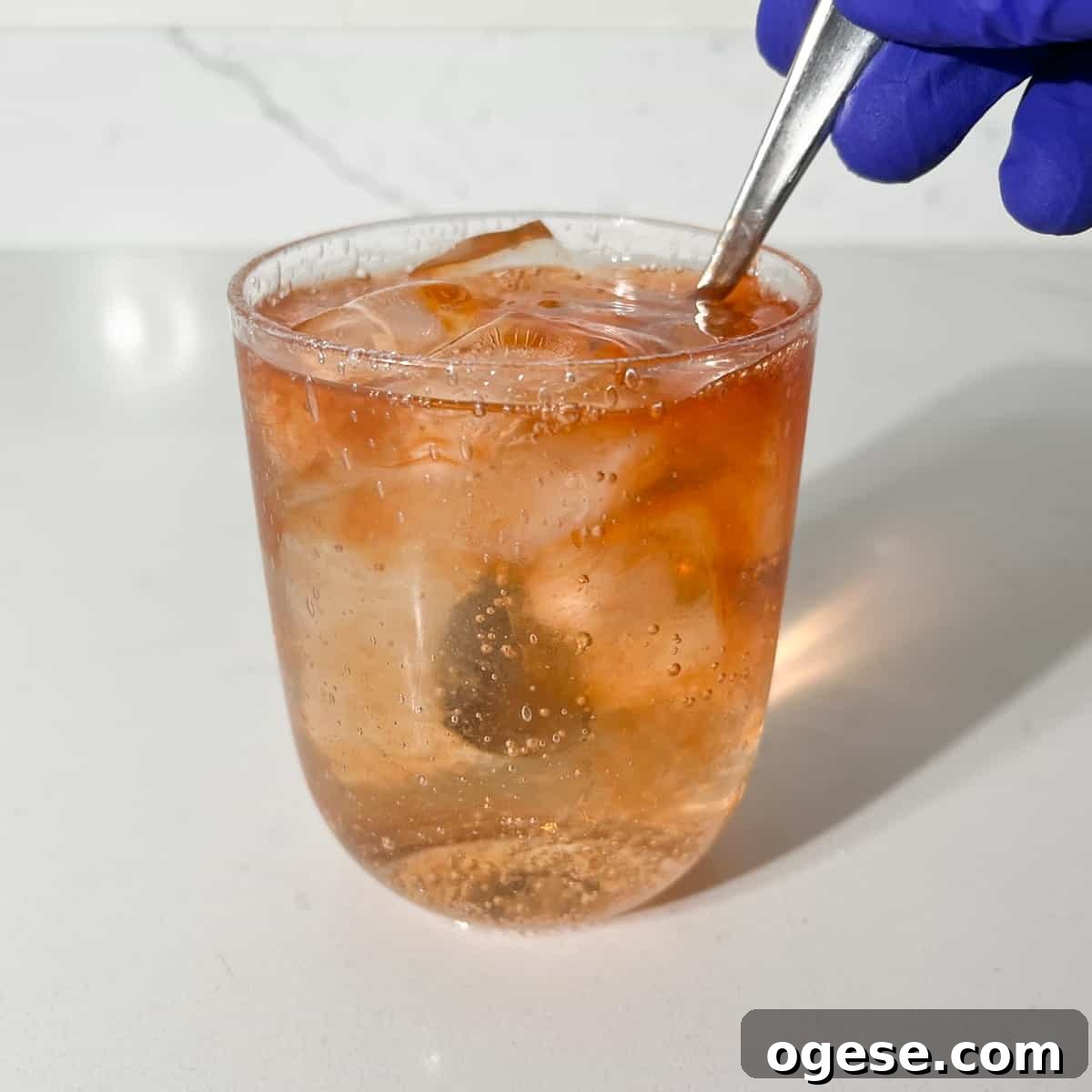 Classic Rock Shandy Recipe: Refreshing Lemon Beer Cocktail Guide 7 Giving the rock shandy a stir with a spoon.