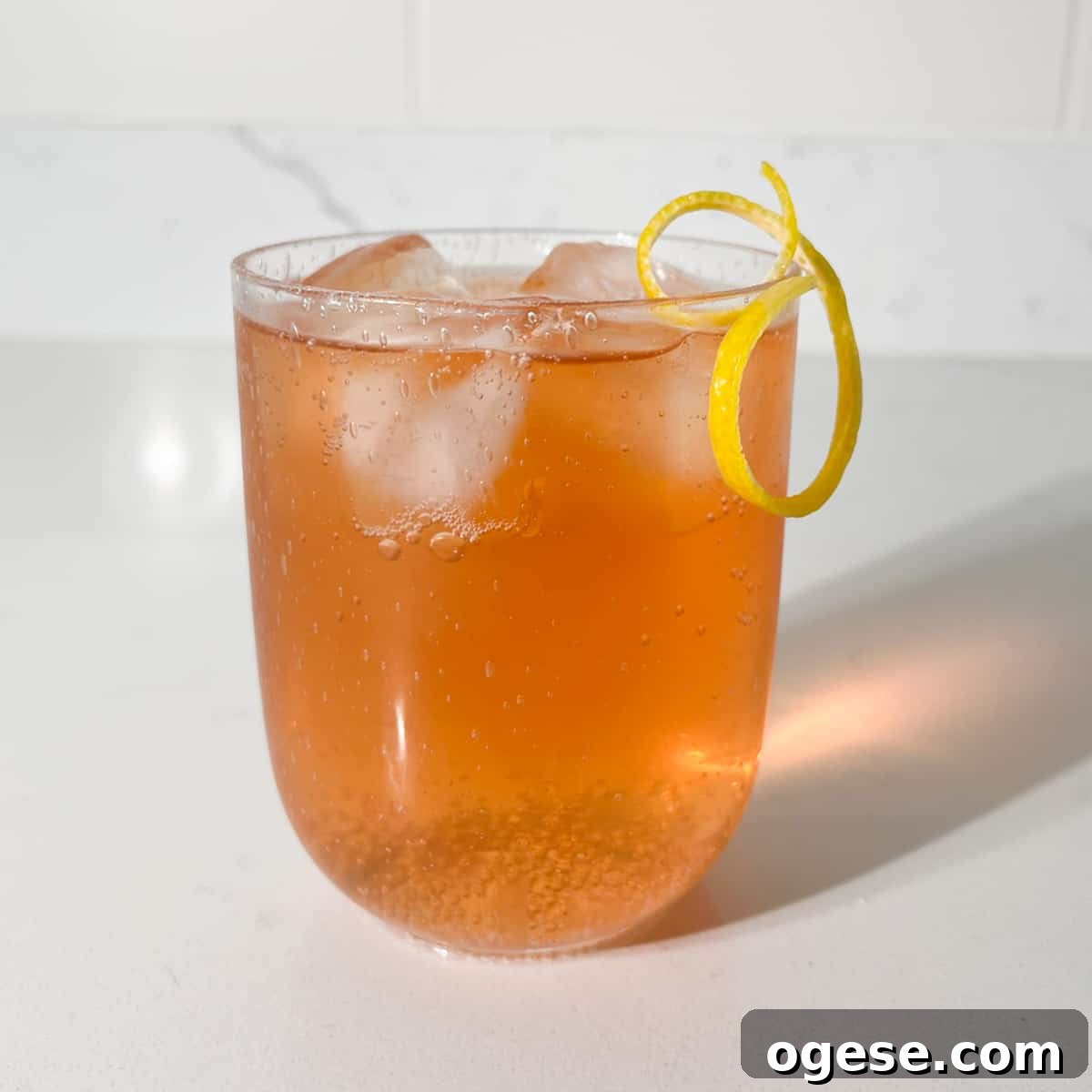 Classic Rock Shandy Recipe: Refreshing Lemon Beer Cocktail Guide 8 A glass of completed rock shandy with a lemon peel twisty.