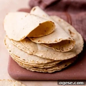 How to Make Authentic Homemade Corn Tortillas at Home 9 Stack of homemade corn tortillas folded over.