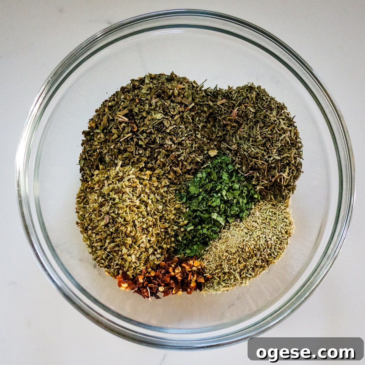 Spices in a clear mixing bowl.