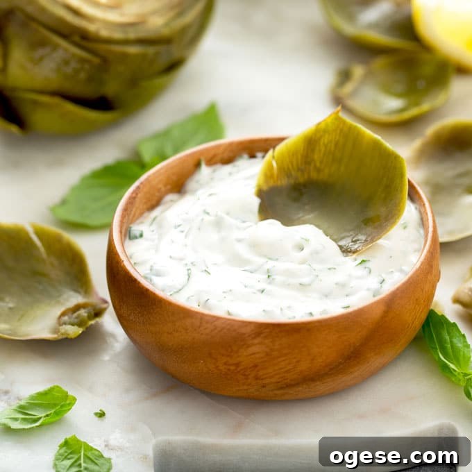 How to Cook Artichokes: Steamed and Roasted Methods 18 Artichoke leave dipped in sauce