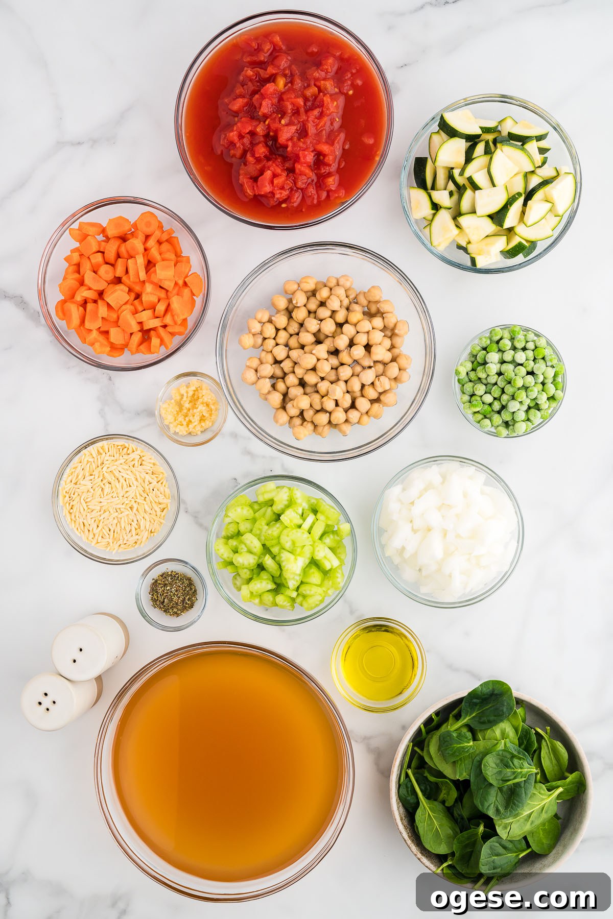 Hearty Vegetable Orzo Soup Recipe for Cozy Weeknights 3 Ingredients to make vegetable orzo soup are set out on the counter.