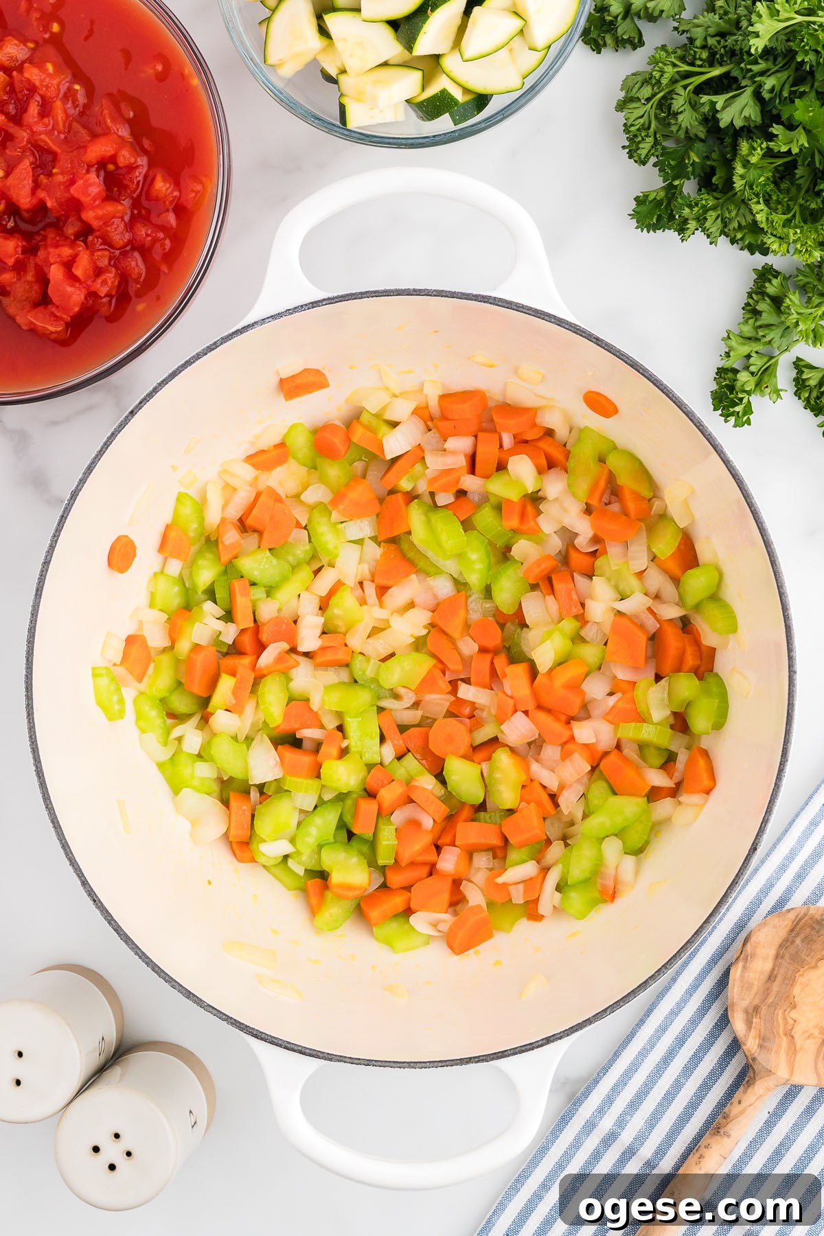 Hearty Vegetable Orzo Soup Recipe for Cozy Weeknights 4 Diced onion, celery, and carrots in a large pot.