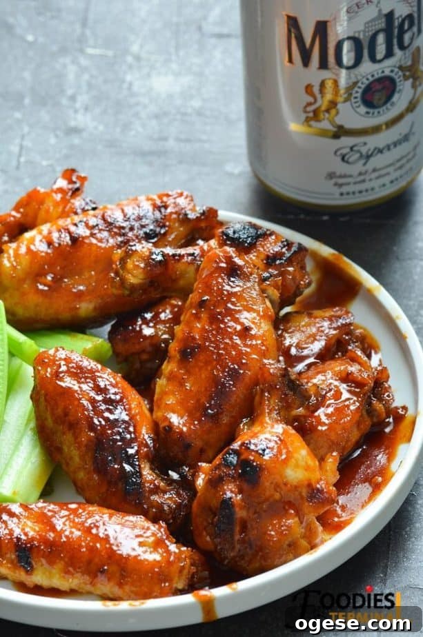 Juicy BBQ Chicken Wings Made Fast in the Instant Pot 2 instant pot bbq chicken wings frozen served on a white plate with beer