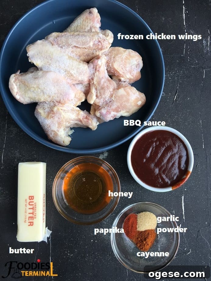 Juicy BBQ Chicken Wings Made Fast in the Instant Pot 4 recipe ingredients on a black surface