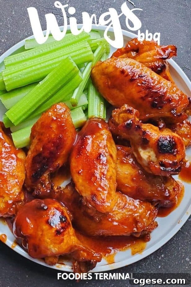 Juicy BBQ Chicken Wings Made Fast in the Instant Pot 7 instant pot bbq chicken wings served with celery sticks on a white plate