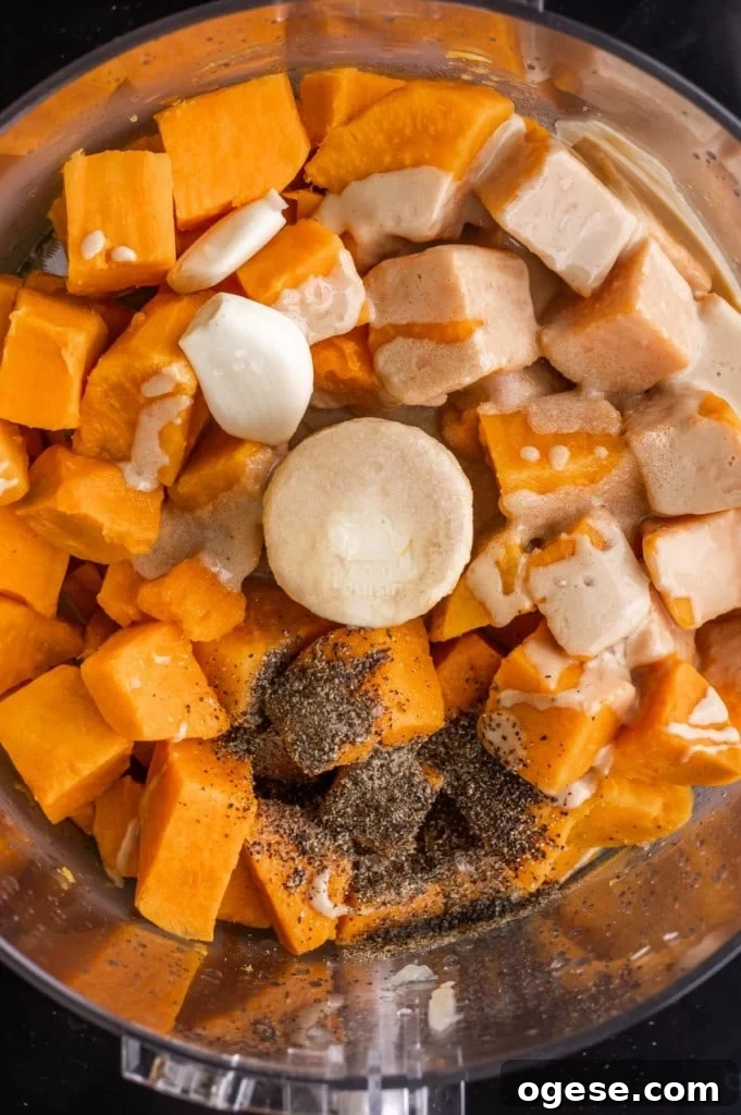 All ingredients for sweet potato hummus in a food processor.
