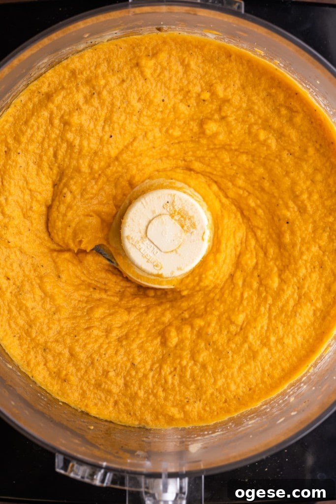 Blended sweet potato hummus in a food processor.