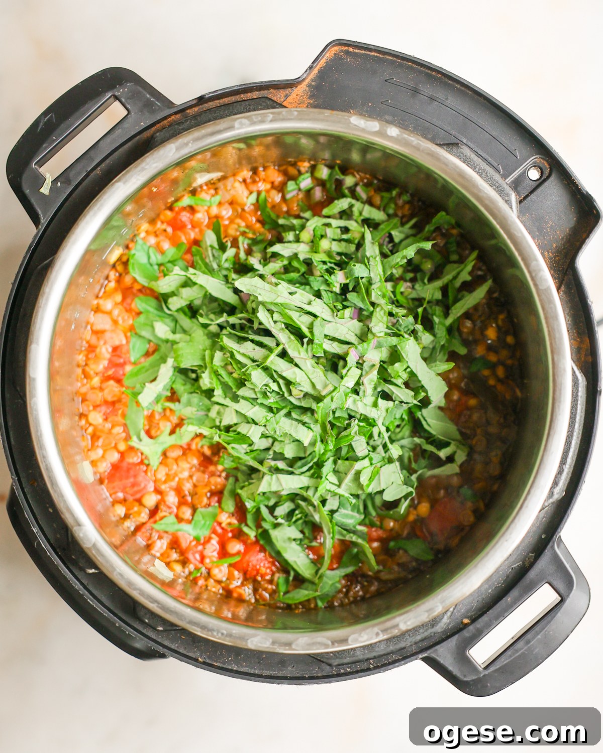 Hearty Instant Pot Lentil Soup Recipe for Busy Weeknights 9 overhead kale added to soup