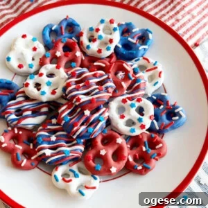 red white and blue pretzels with patriotic sprinkles on a red and white plate.