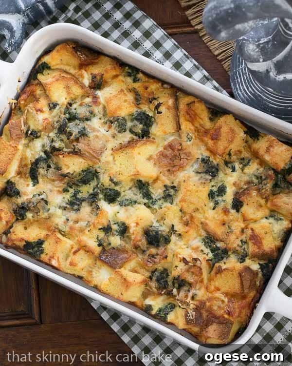 Gruyère and Spinach Strata Recipe for Brunch or Holiday Breakfast 3 Gruyere Spinach Strata in a white casserole dish.