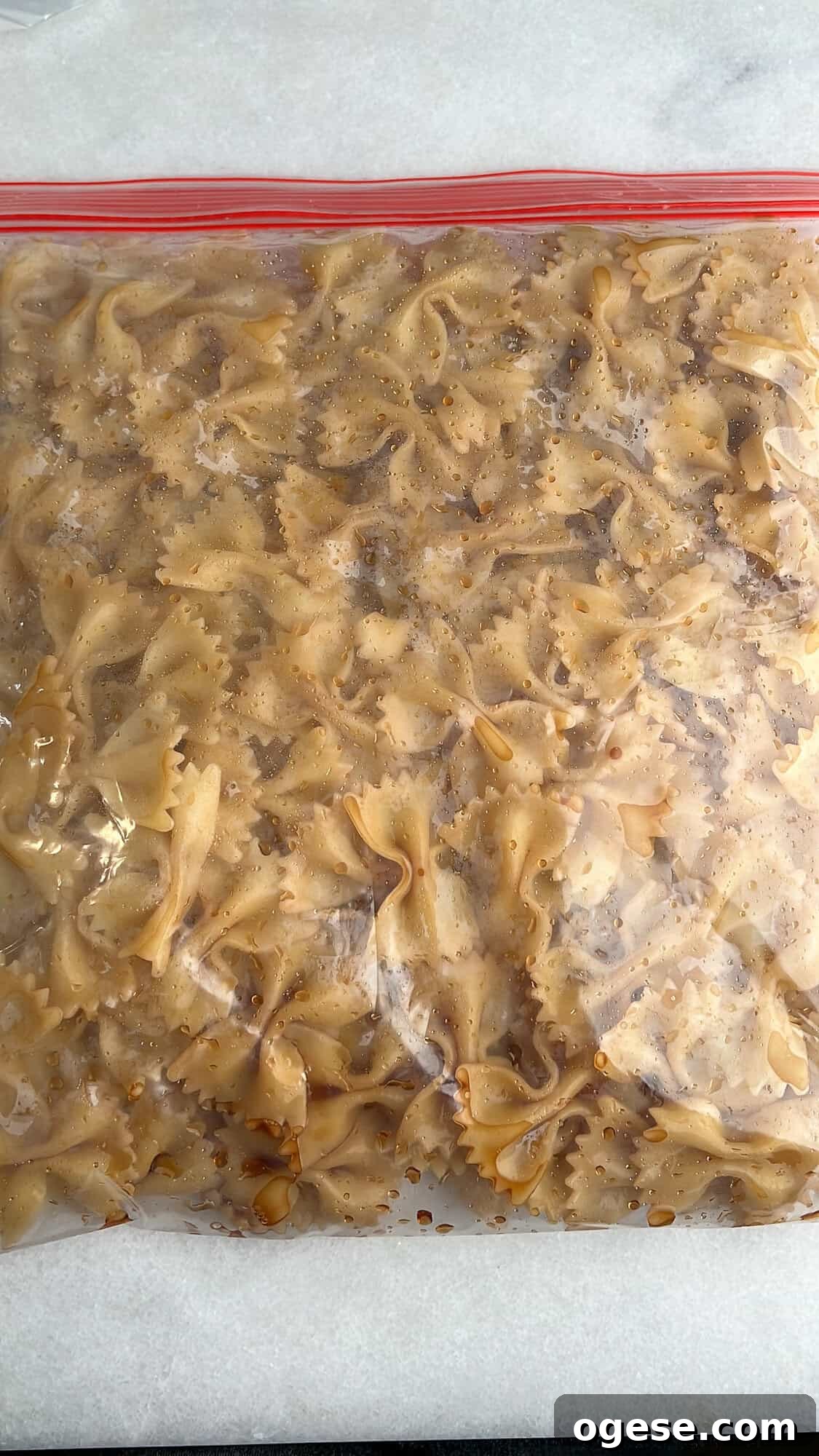 Bow tie pasta tossed with balsamic vinegar Bow tie pasta in a ziploc bag with balsamic vinegar