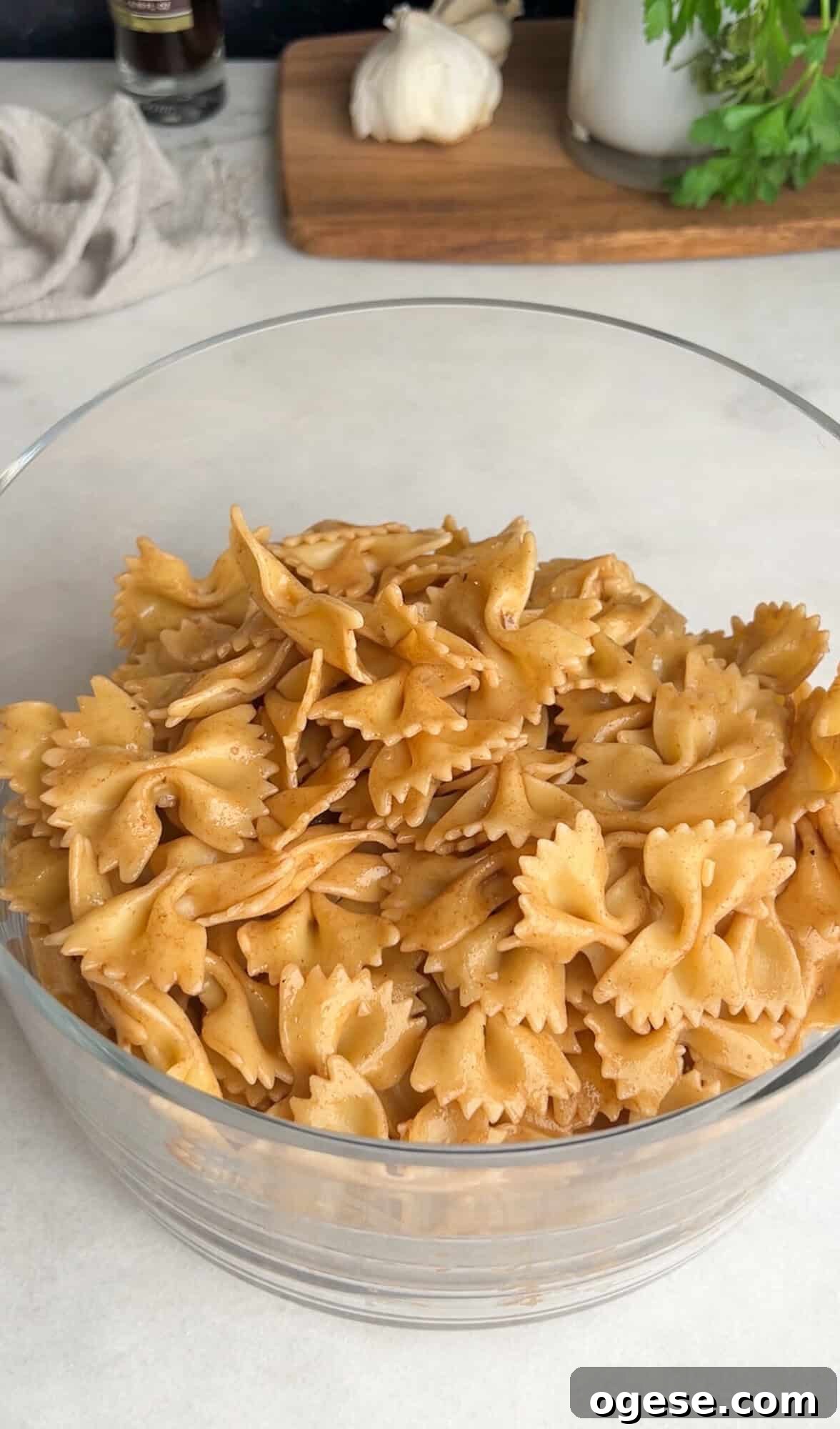 Cooked bow tie pasta in a glass bowl Bow tie noodles in a glass bowl