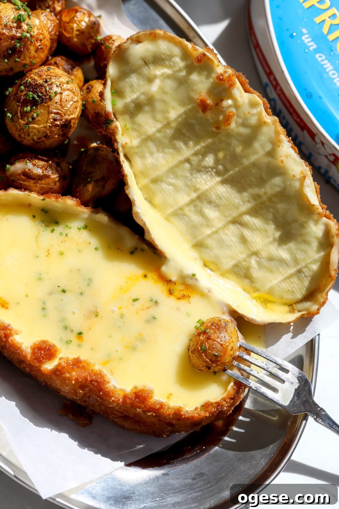 Crispy Fried Cheese Wheel Recipe: Gooey Center, Crunchy Crust 3 Creamy melted cheese inside the soft cheese wheel with roasted baby potatoes for dipping.