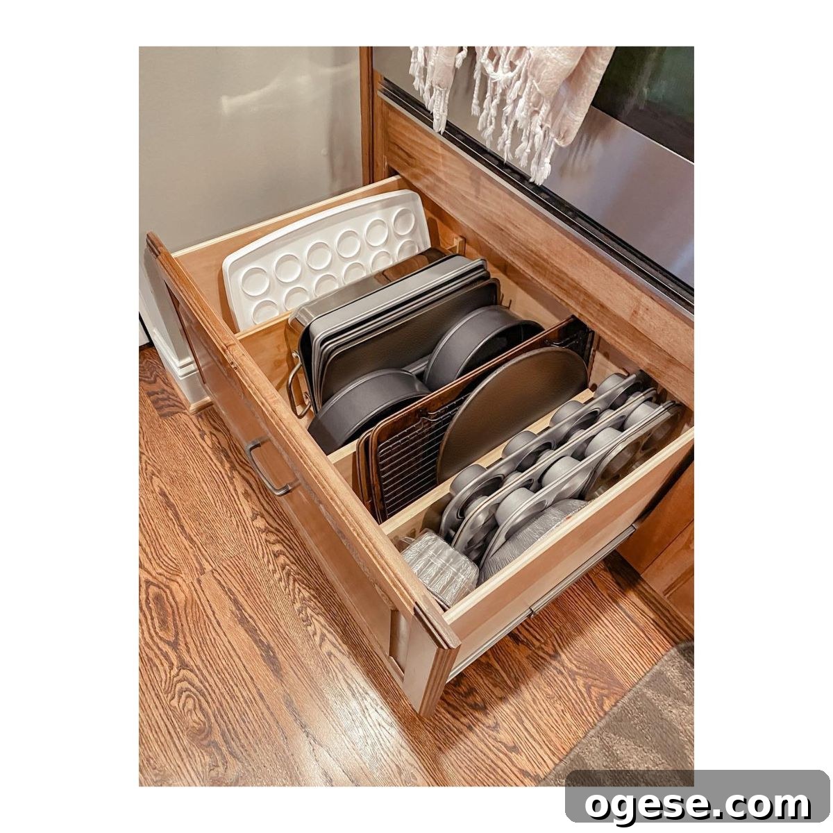 Drawer dividers organizing baking sheets vertically