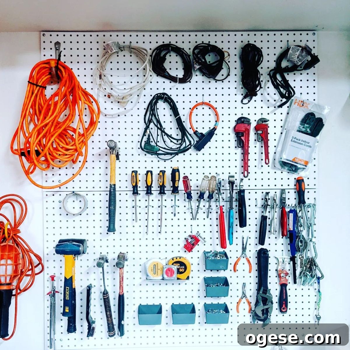 Pegboard with tools and art supplies