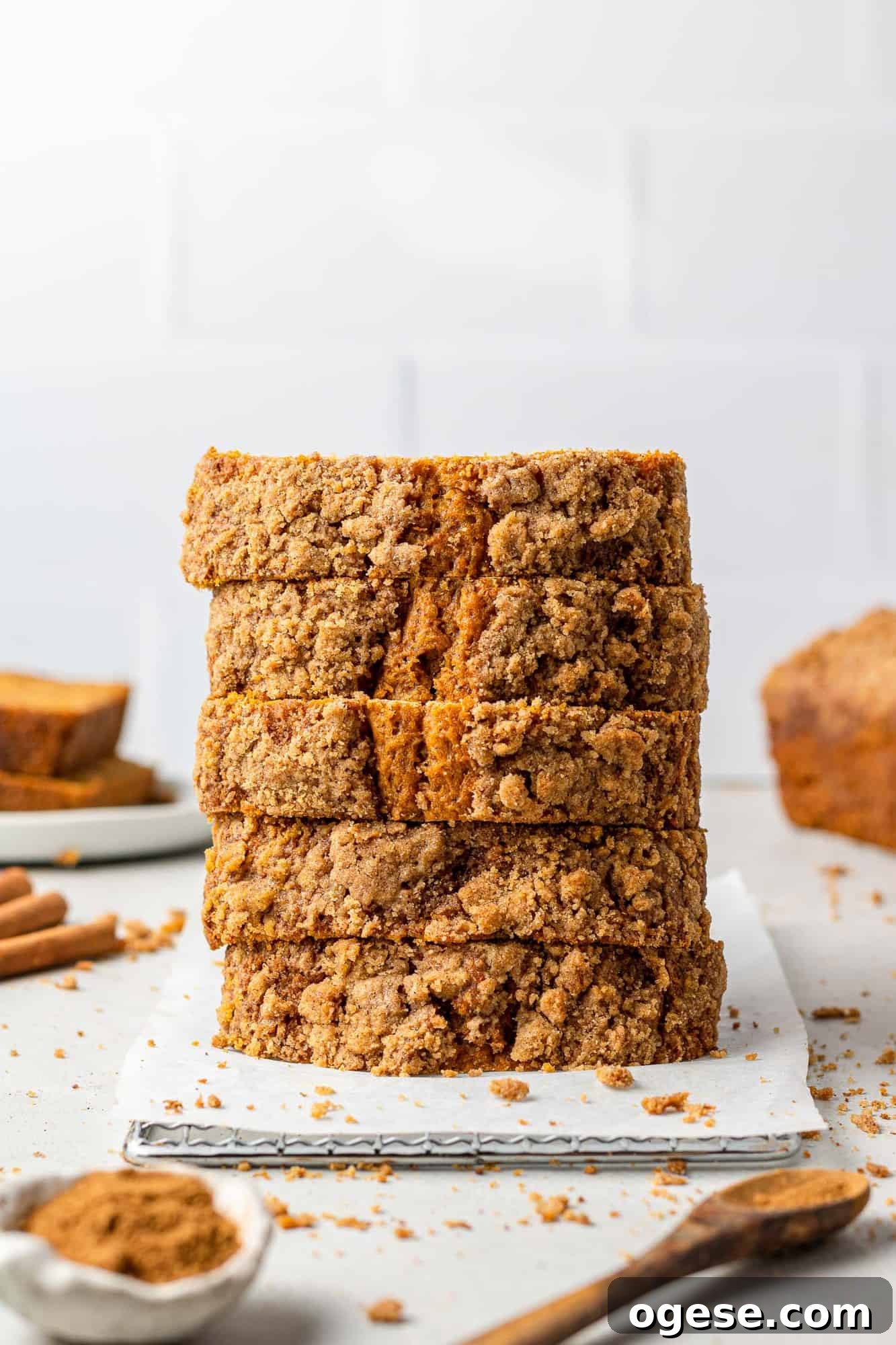Pumpkin streusel bread Stack of pumpkin bread slices, with spices around.