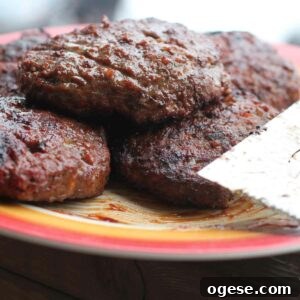 The Best BBQ Burgers on a Plate with a Spatula