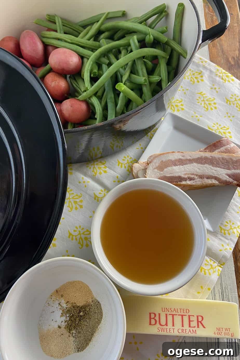 Southern-Style Green Beans with New Potatoes 3 Ingredients labeled on a white table.