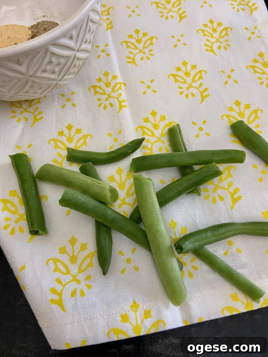 Southern-Style Green Beans with New Potatoes 4 "Snapped" green beans on counter.