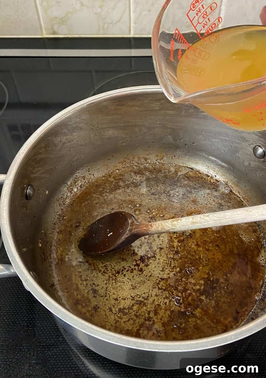 Southern-Style Green Beans with New Potatoes 6 Chicken broth being poured into pot.