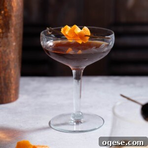 Nocino Cocktail: Crafting a Black Manhattan with Walnut Liqueur 11 A Nocino Black Manhattan cocktail garnished with orange peel