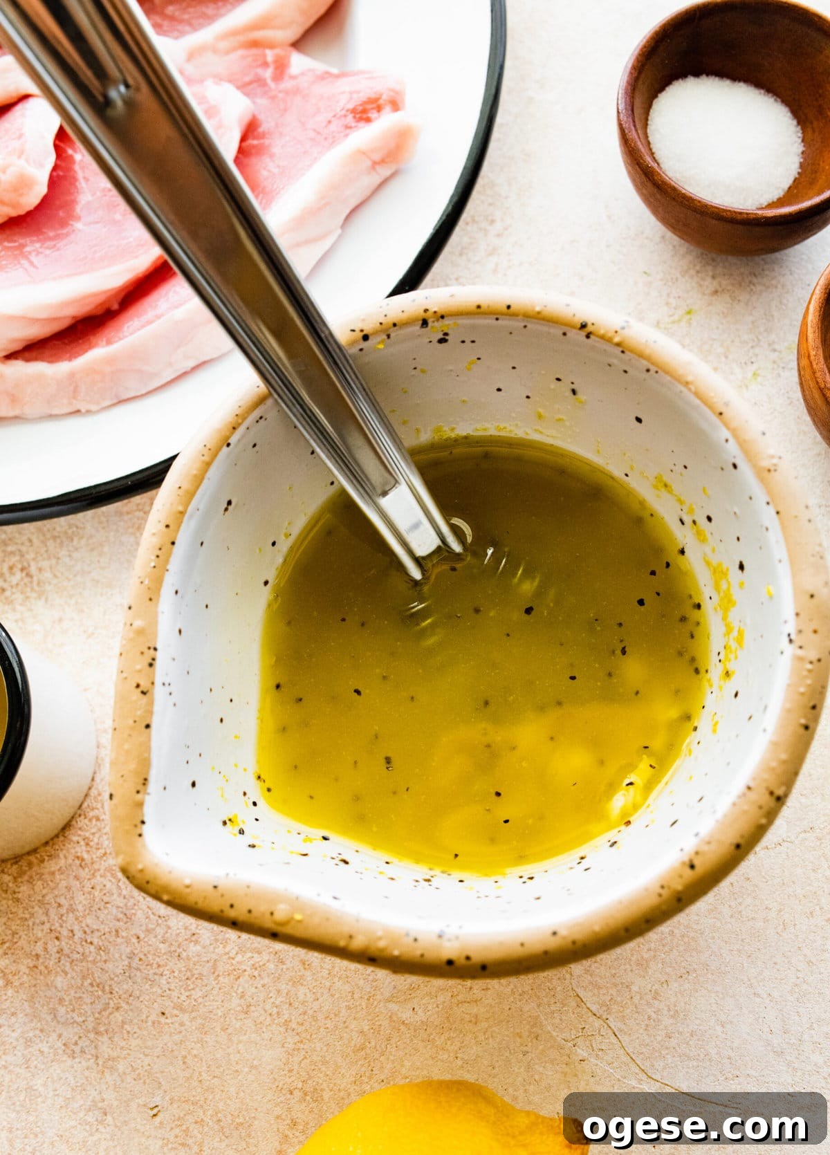 Perfectly Pan-Seared Thin Pork Chops: Quick Juicy Recipe 8 How to Make Best Juicy Thin Pork Chops Step by Step: mixing marinade ingredients in a bowl.