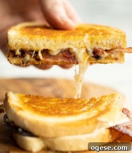 hand pulled half grilled cheese with cheese dripping out