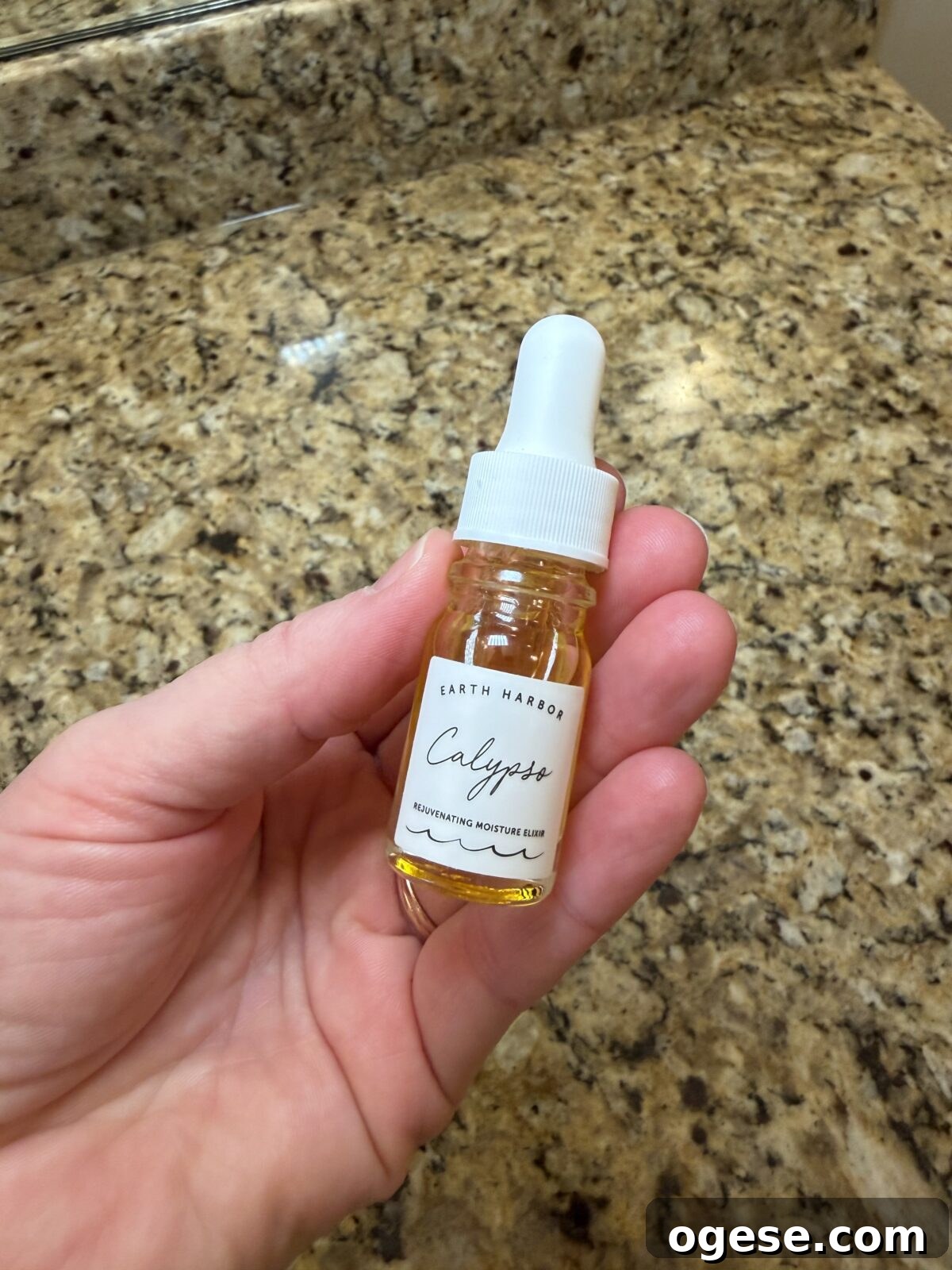 Earth Harbor Skincare Review: Real Pros, Cons, and Results 11 Glass dropper bottle of Earth Harbor "Calypso" Rejuvenating Moisture Elixir with golden oil