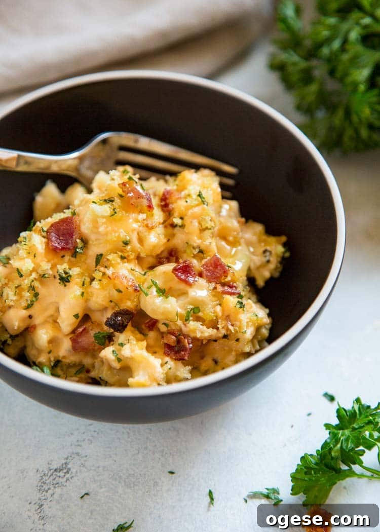 My Bacon Mac and Cheese Casserole is loaded with crisp bacon, cheddar, mozzarella and cream cheese. Topped with buttery Panko breadcrumbs. Pasta perfection! My Bacon Mac and Cheese Casserole is loaded with crisp bacon, cheddar, mozzarella and cream cheese. Topped with buttery Panko breadcrumbs. Pasta perfection! keviniscooking.com