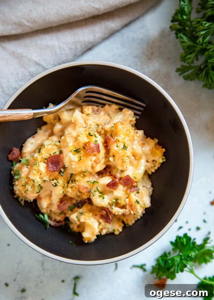 My Bacon Mac and Cheese Casserole is loaded with crisp bacon, cheddar, mozzarella and cream cheese. Topped with buttery Panko breadcrumbs. Pasta perfection! My Bacon Mac and Cheese Casserole is loaded with crisp bacon, cheddar, mozzarella and cream cheese. Topped with buttery Panko breadcrumbs. Pasta perfection! keviniscooking.com