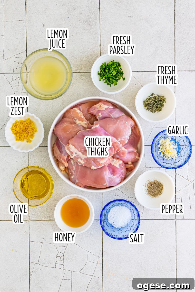 ingredients to make lemon garlic grilled chicken thighs in bowls with text labels