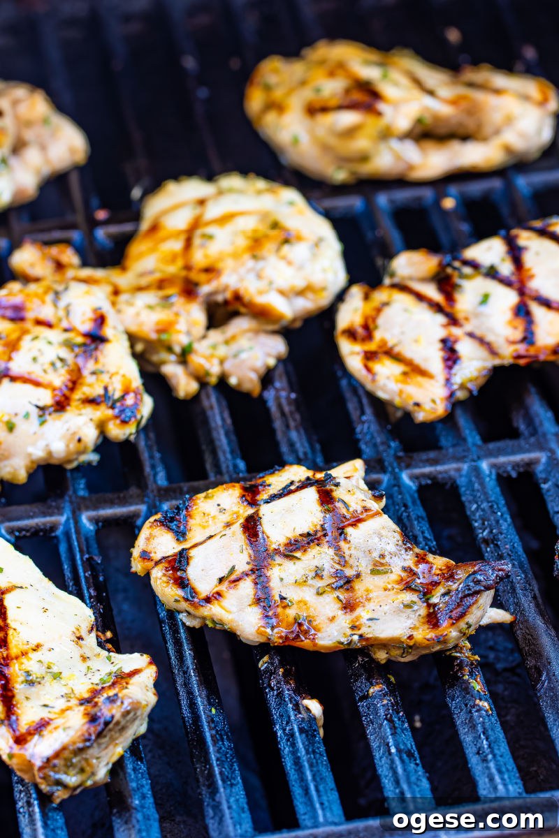 lemon garlic chicken thighs cooking on the grill
