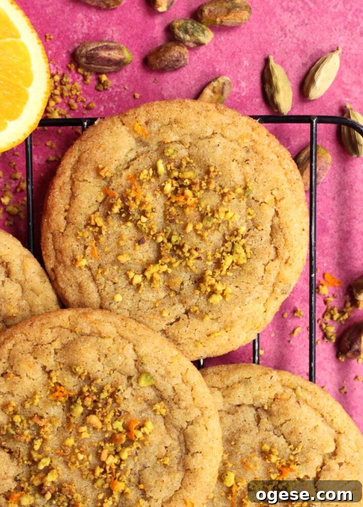 chewy orange cardamom pistachio sugar cookies on cooling rack