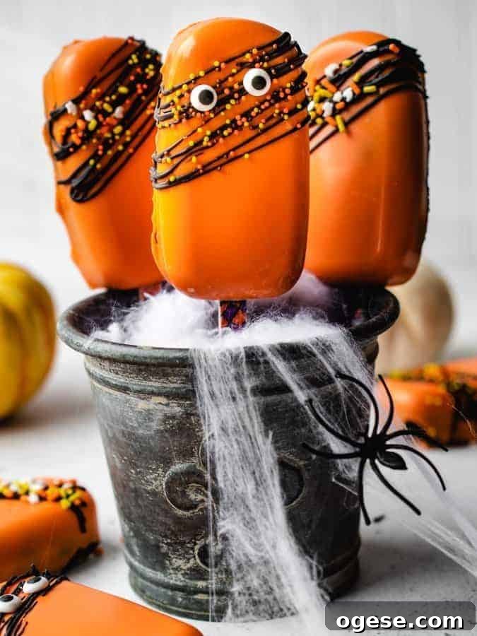 Spooky Halloween Cakesicles: Fun No-Bake Party Treats 4 Decorated cakesicles with sprinkles and eyes