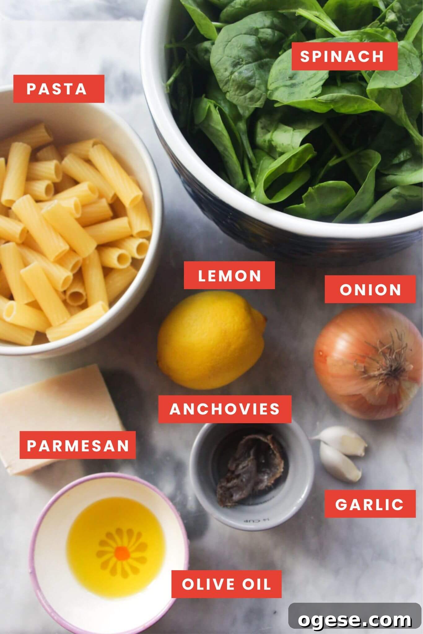 15-Minute Super Green Rigatoni Recipe for Quick Weeknight Dinner 3 Ingredients for green pasta sauce labelled and laid out on a grey marble background.