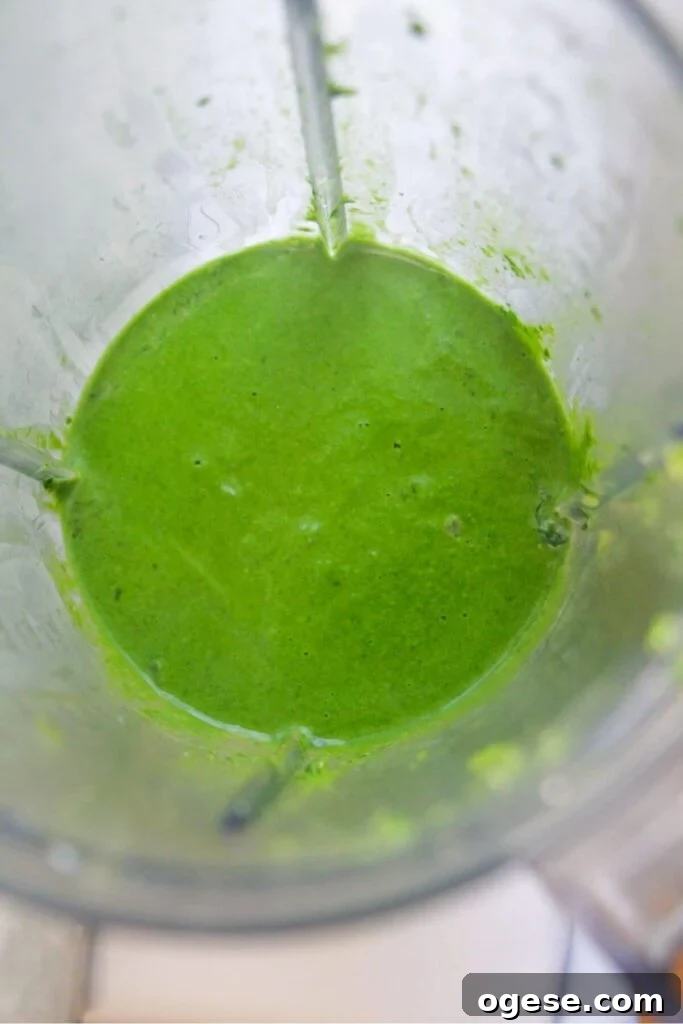 15-Minute Super Green Rigatoni Recipe for Quick Weeknight Dinner 9 Smooth green pasta sauce in a blender after being blitzed.