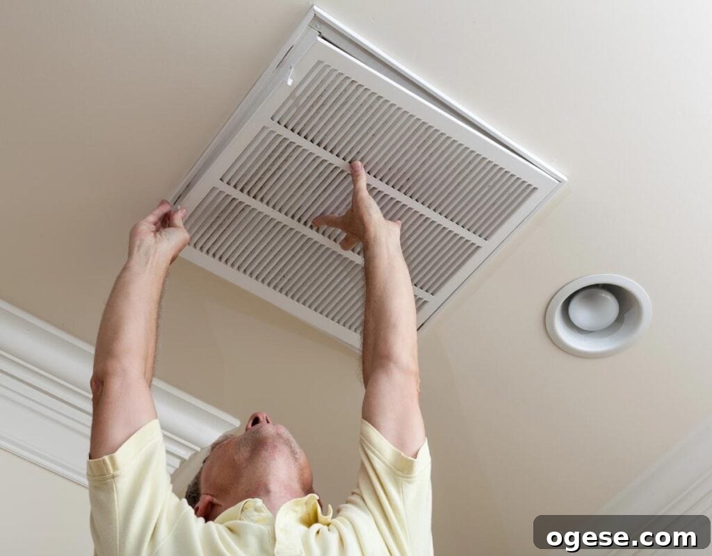 Furnace Maintenance Checklist for a Safe, Cozy Home 3 man changing the hvac filter