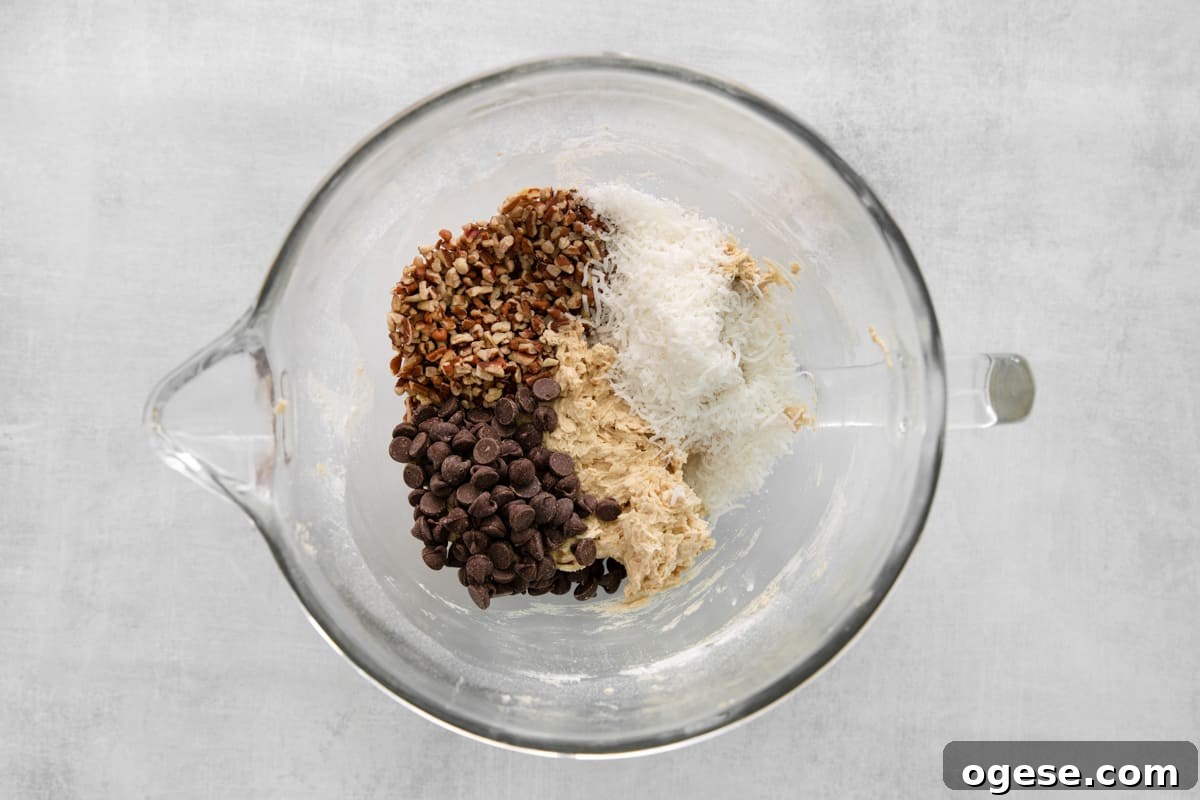 Hearty Cowboy Cookie Recipe with Oats, Chocolate & Nuts 8 ingredients in a large mixing bowl