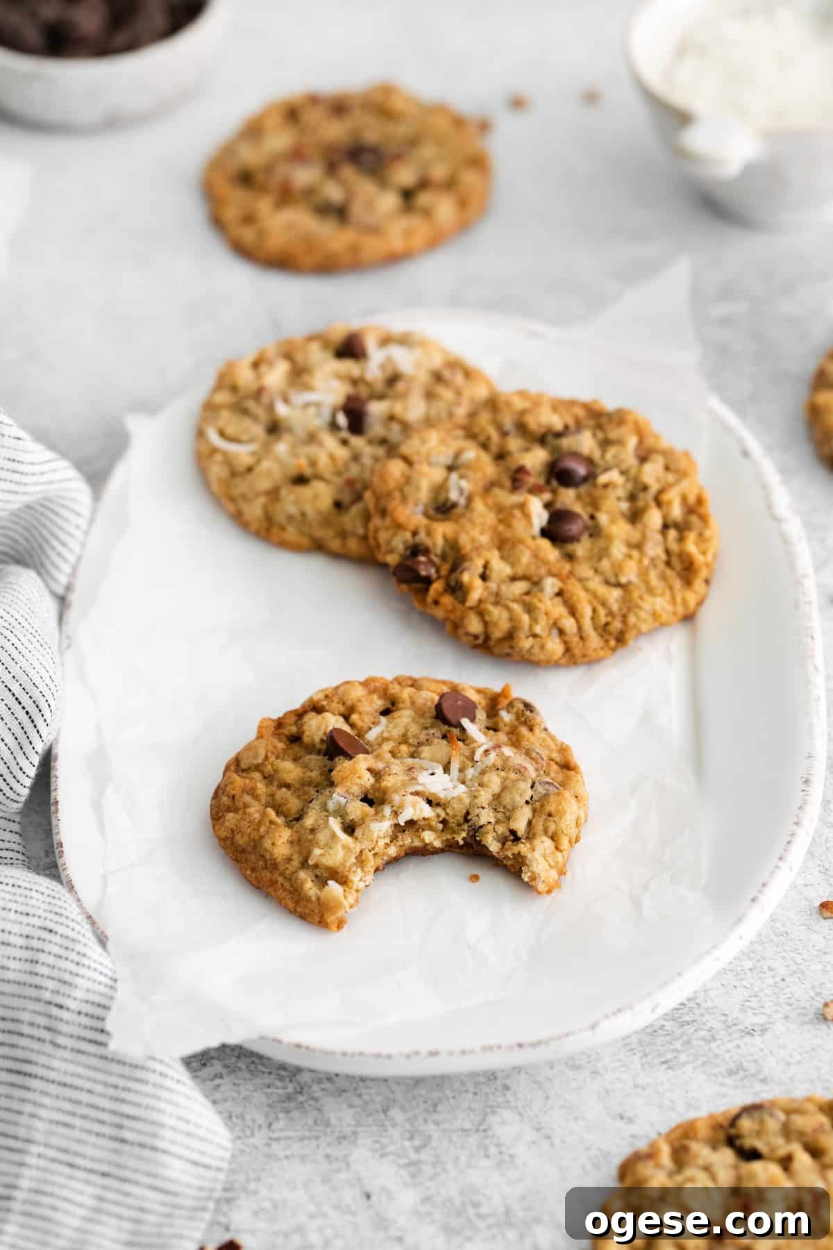 Hearty Cowboy Cookie Recipe with Oats, Chocolate & Nuts 3 cowboy cookies on a serving plate